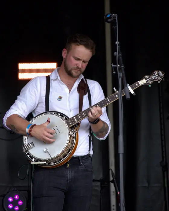 Fergus on banjo under the stage lights